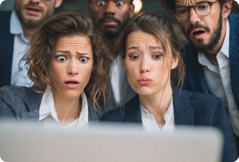 Surprised compliance team looking at a laptop